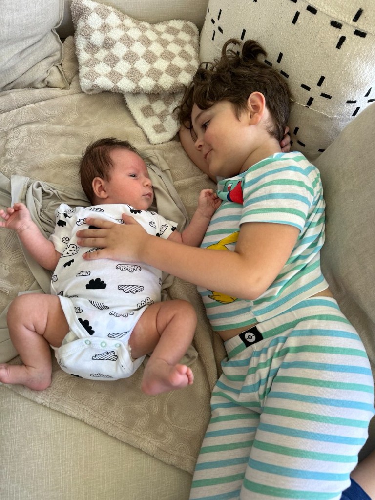 Aziz as a young child with his baby brother